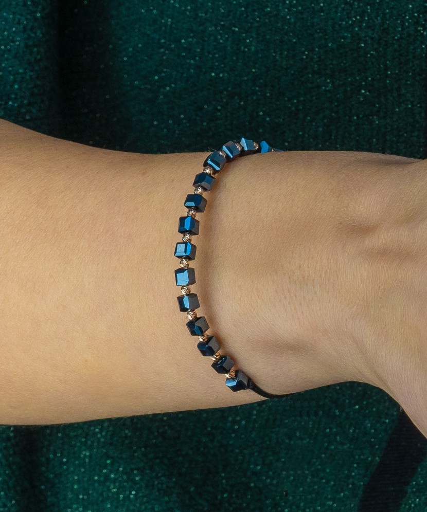 Black string bracelet with gold And Hematites