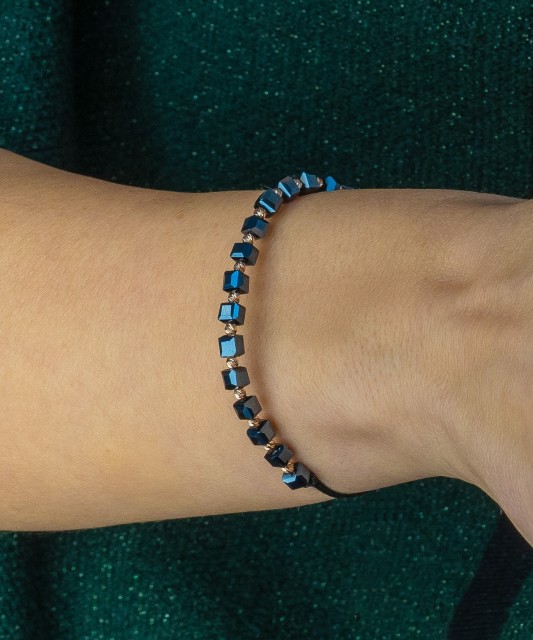 Black string bracelet with gold And Hematites