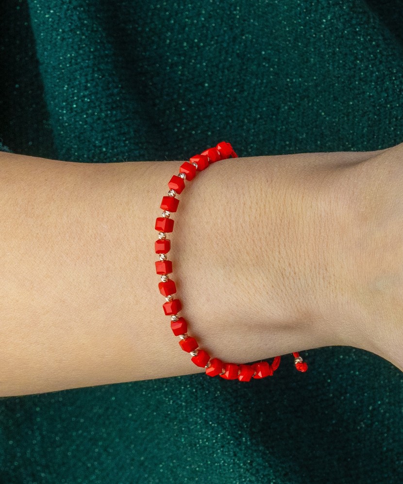 Red string bracelet with gold