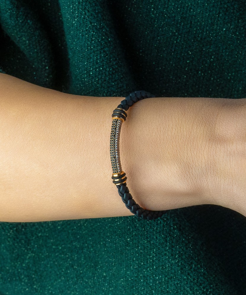 Leather bracelet with gold and zircons