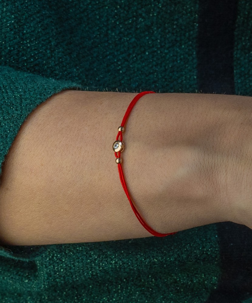 Red string bracelet with zirconium pendant