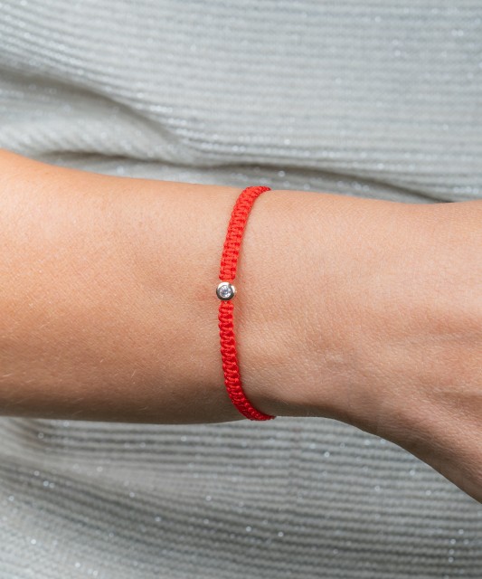 Red string bracelet with gold pendant