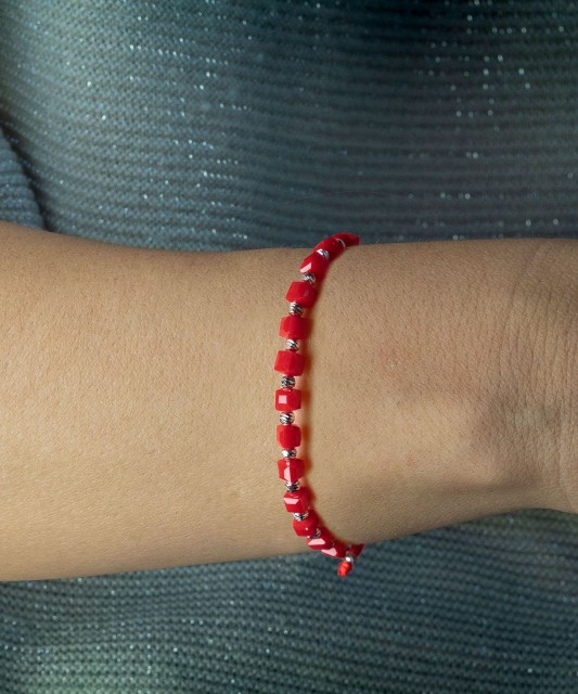 Red string bracelet with silver and onyxes