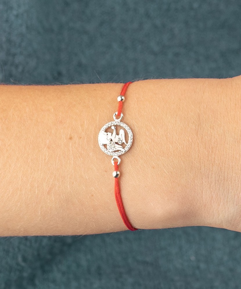 Red string bracelet with a silver pendant "angel"