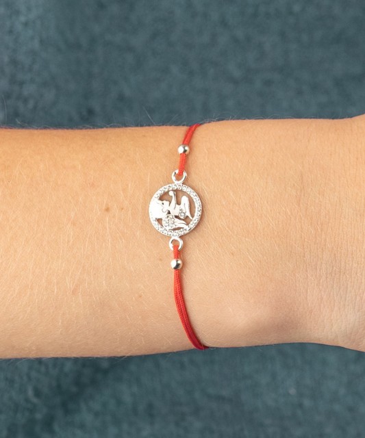 Red string bracelet with a silver pendant "angel"