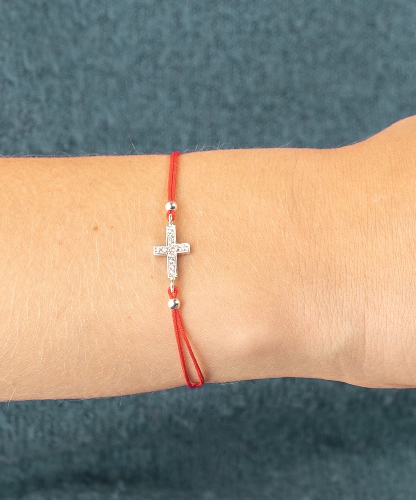 Red string bracelet with a silver pendant "Cross"