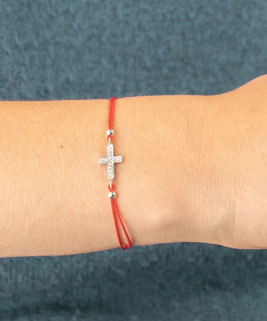 Red string bracelet with a silver pendant "Cross"