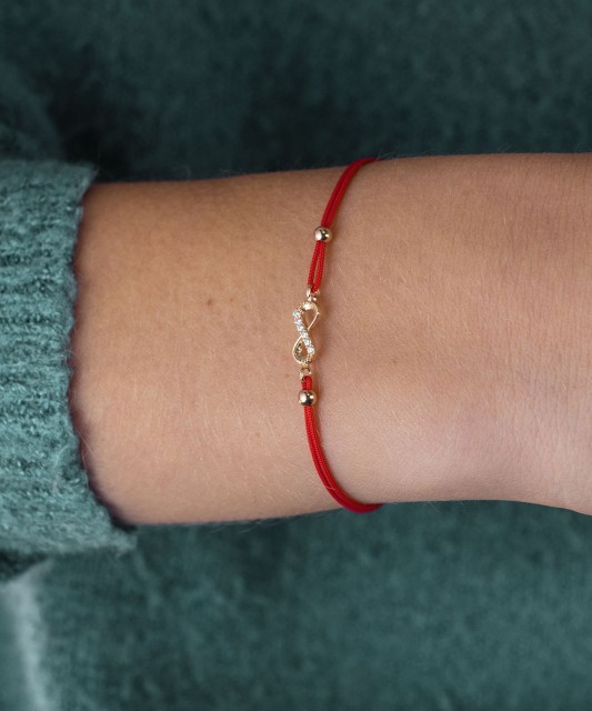 Red string bracelet with gold pendant "Infinity"