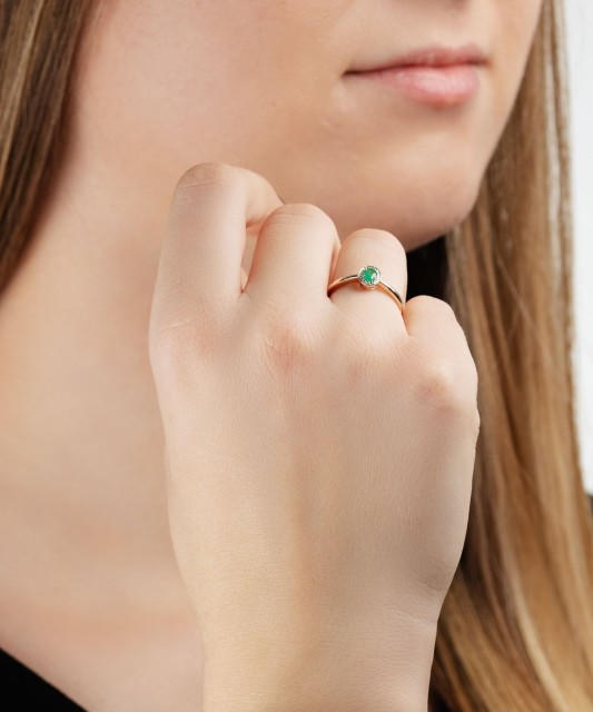 Gold ring with emerald and diamonds