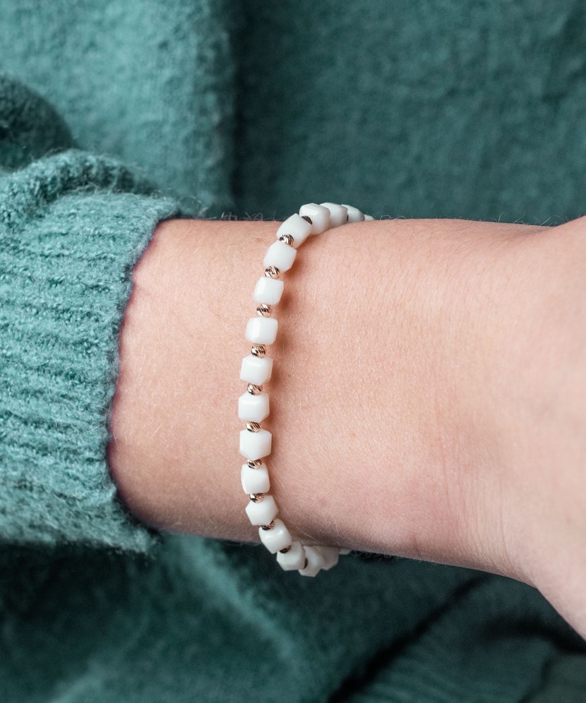 White string bracelet with gold and onyxes