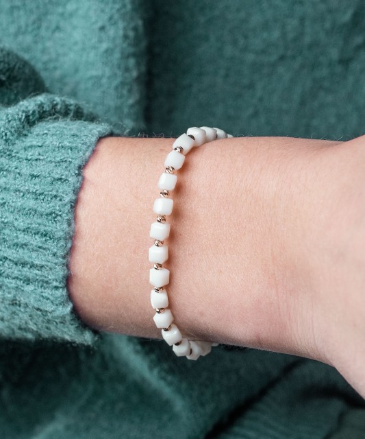 White string bracelet with gold and onyxes