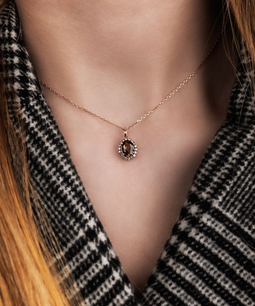 Gold pendant with diamonds and smoky quartz