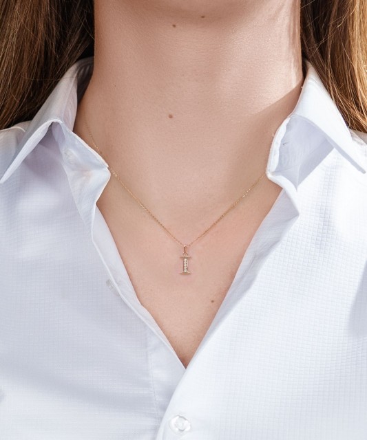 Gold pendant with zircons Letter I