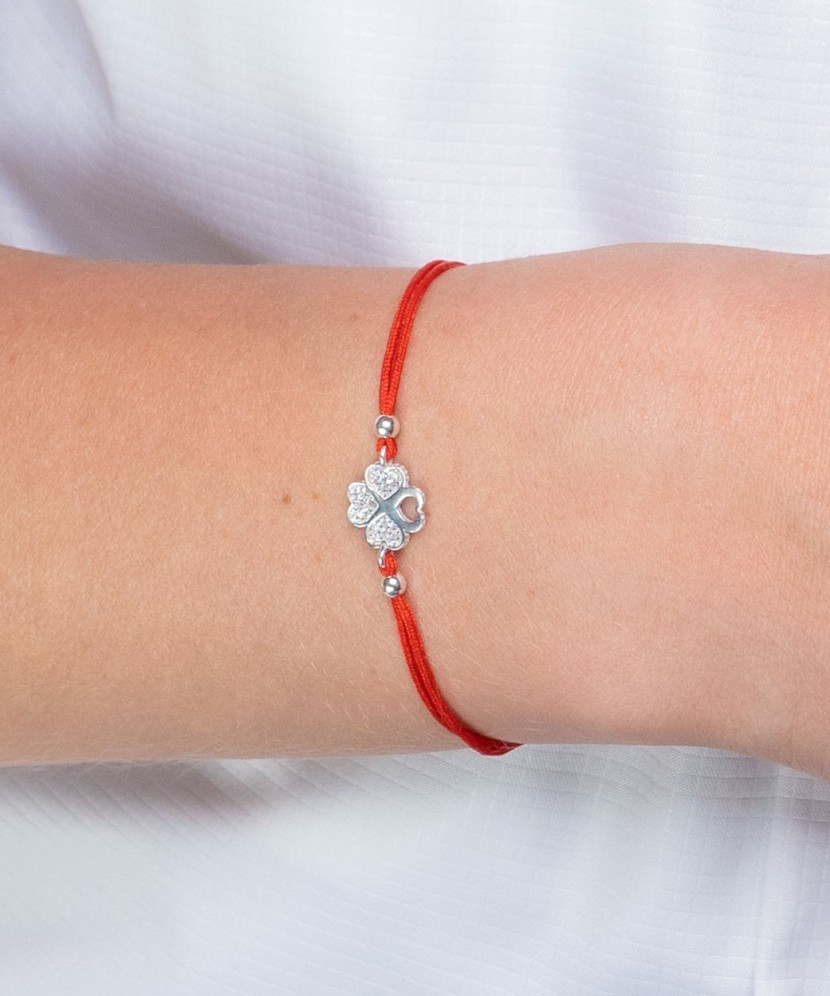 Red string bracelet with a silver pendant and zirconium "Dobilas"