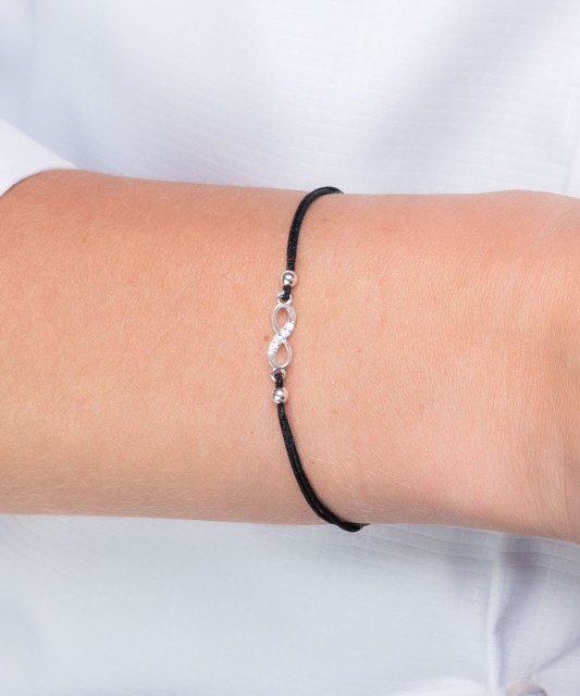 Black string bracelet with a silver pendant and zirconium "Infinity"