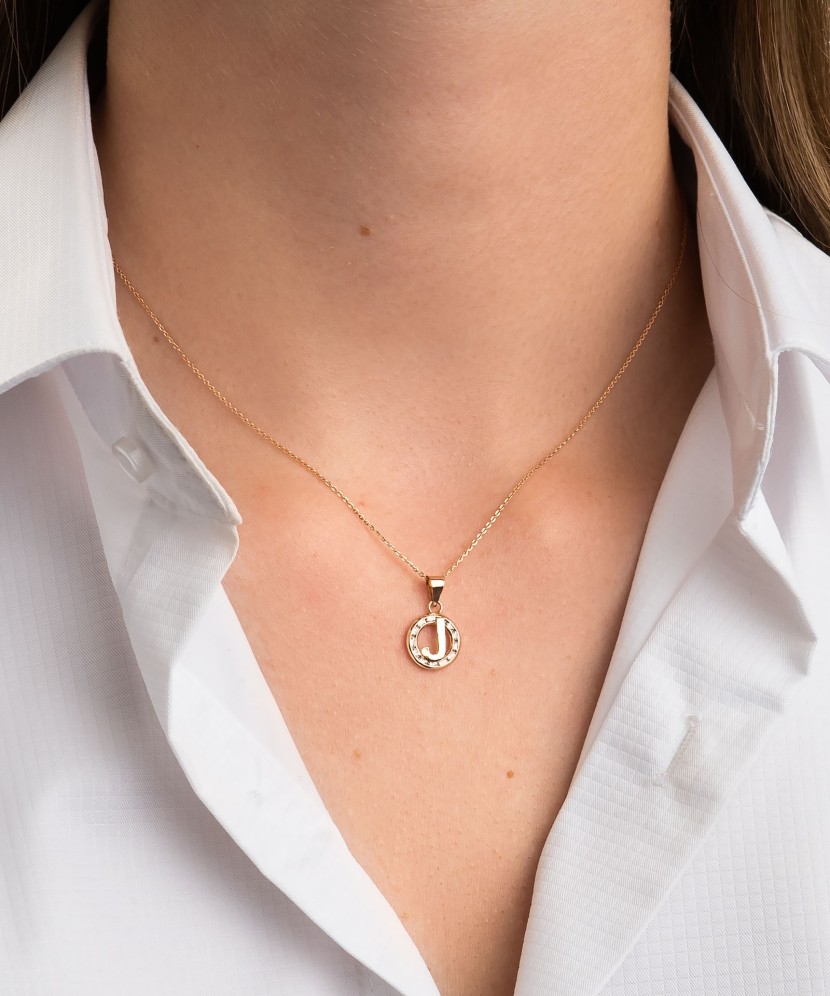 Gold pendant with zircons Letter J