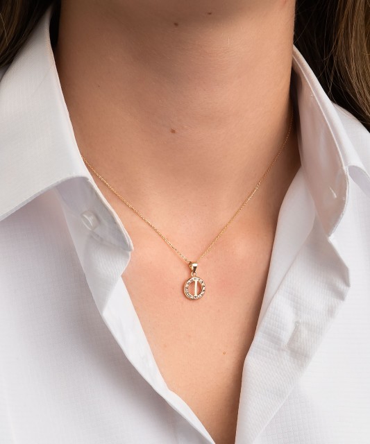 Gold pendant with zircons Letter I