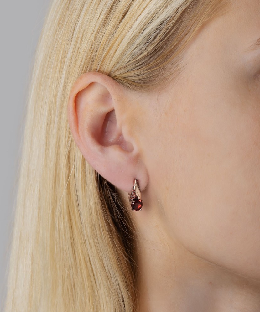 Gold earrings with garnet and zircons