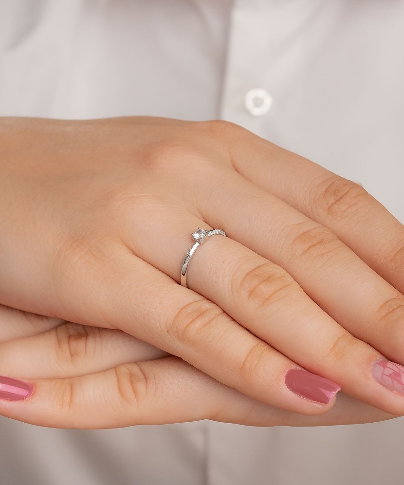 White gold ring with zircons