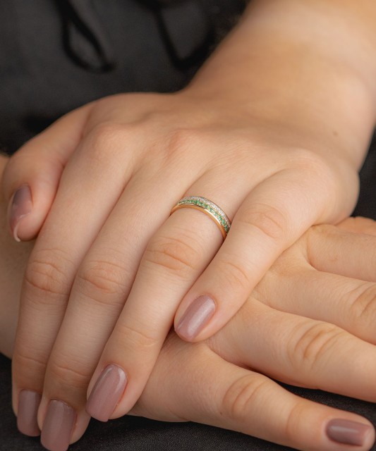 Gold ring with diamonds and emeralds
