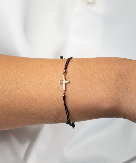 Black string bracelet with a gold pendant "cross"