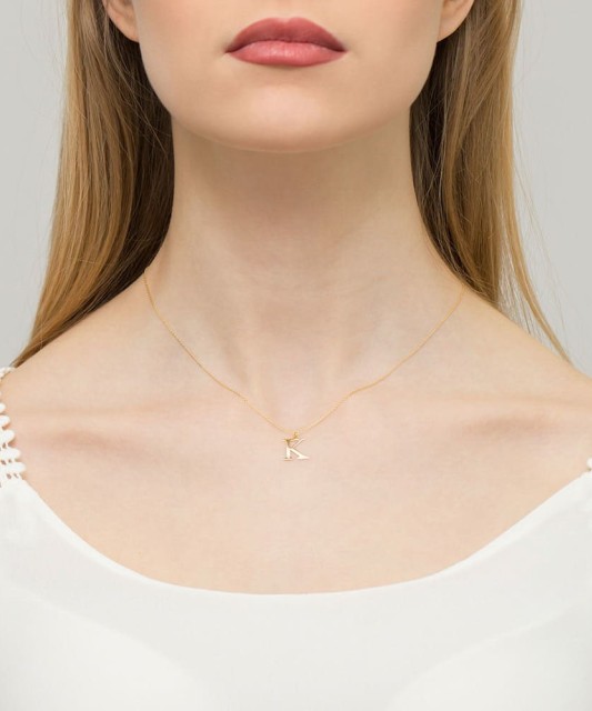 Gold pendant with diamond letter K