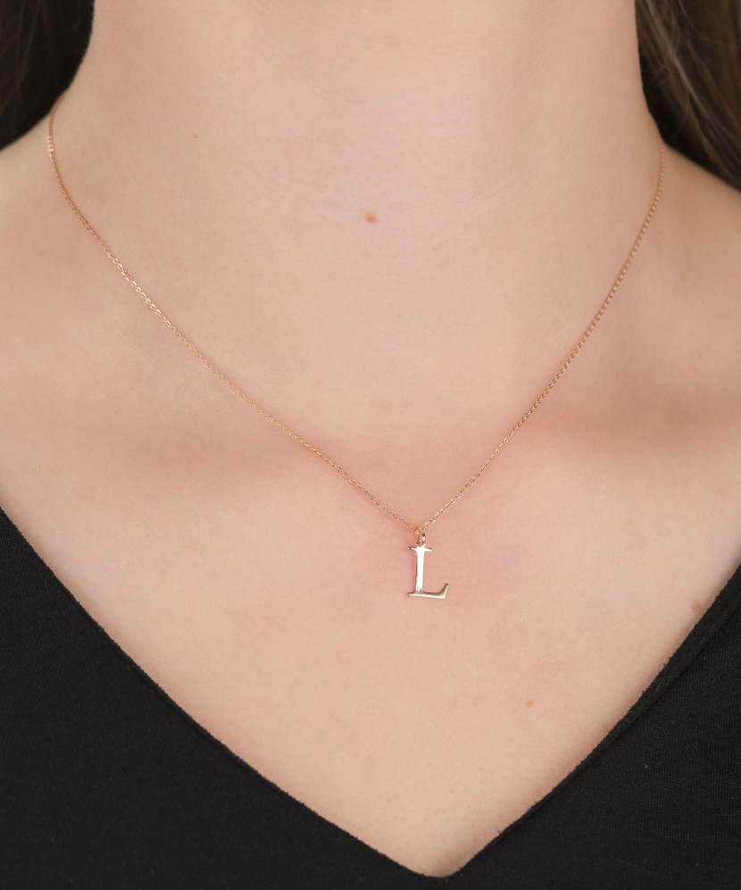 Gold pendant with diamond letter L