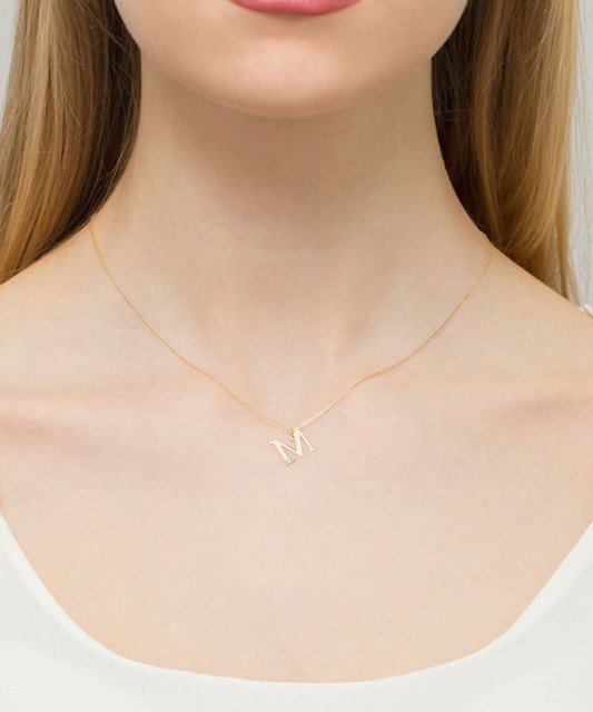 Gold pendant with diamond letter M