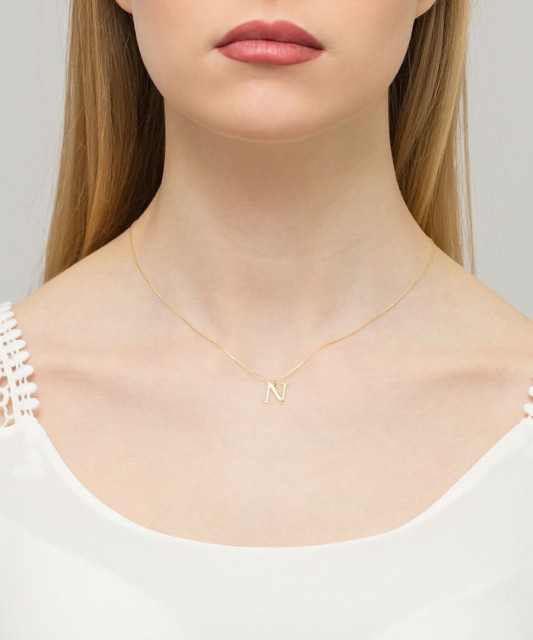Gold pendant with diamond letter N