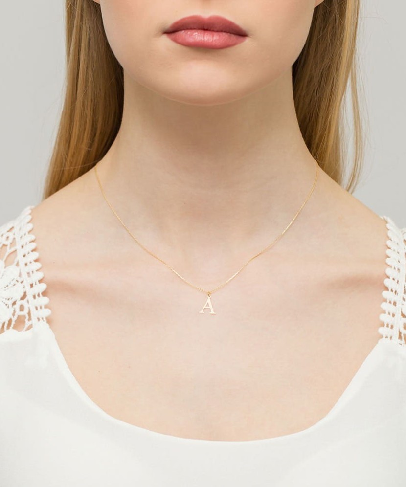 Gold pendant with diamond letter A