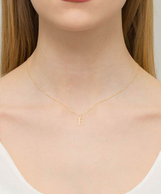 Gold pendant with diamond letter E