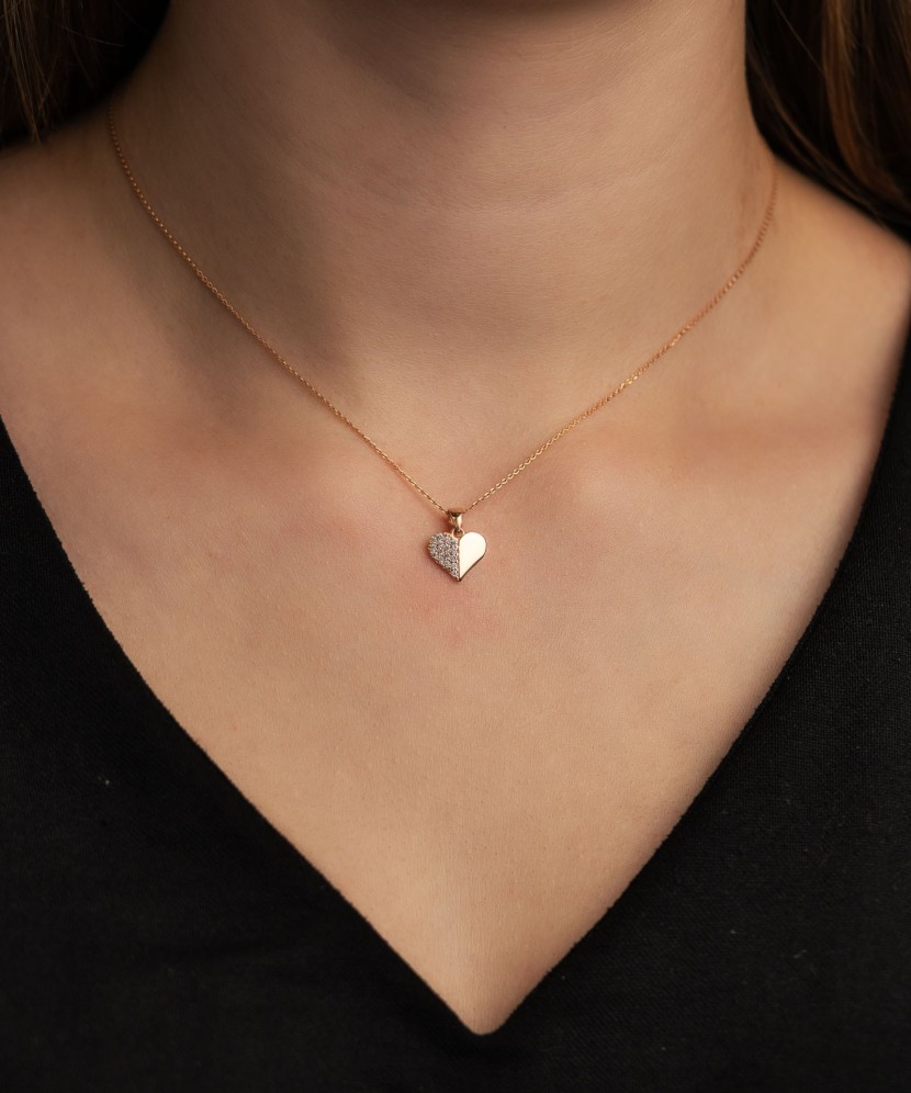 Gold pendant with zircons "heart"