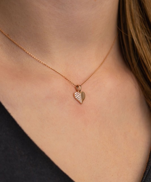 Gold pendant with zircons "heart"