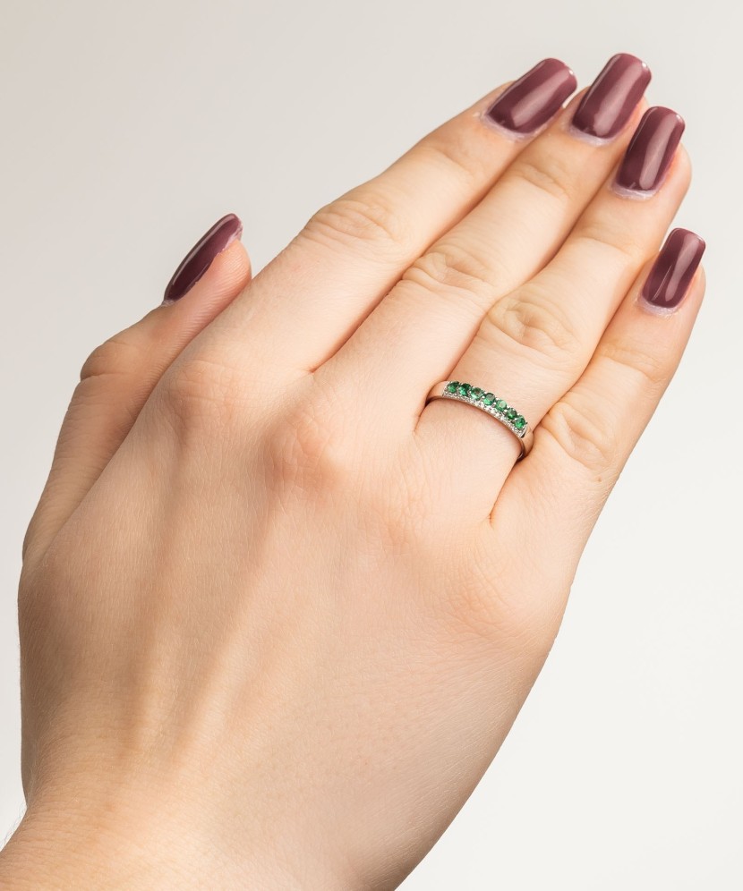 White gold ring with diamonds and emeralds