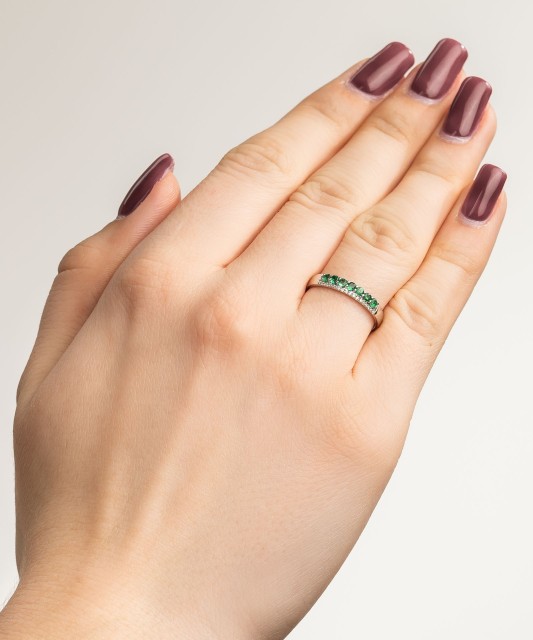 White gold ring with diamonds and emeralds