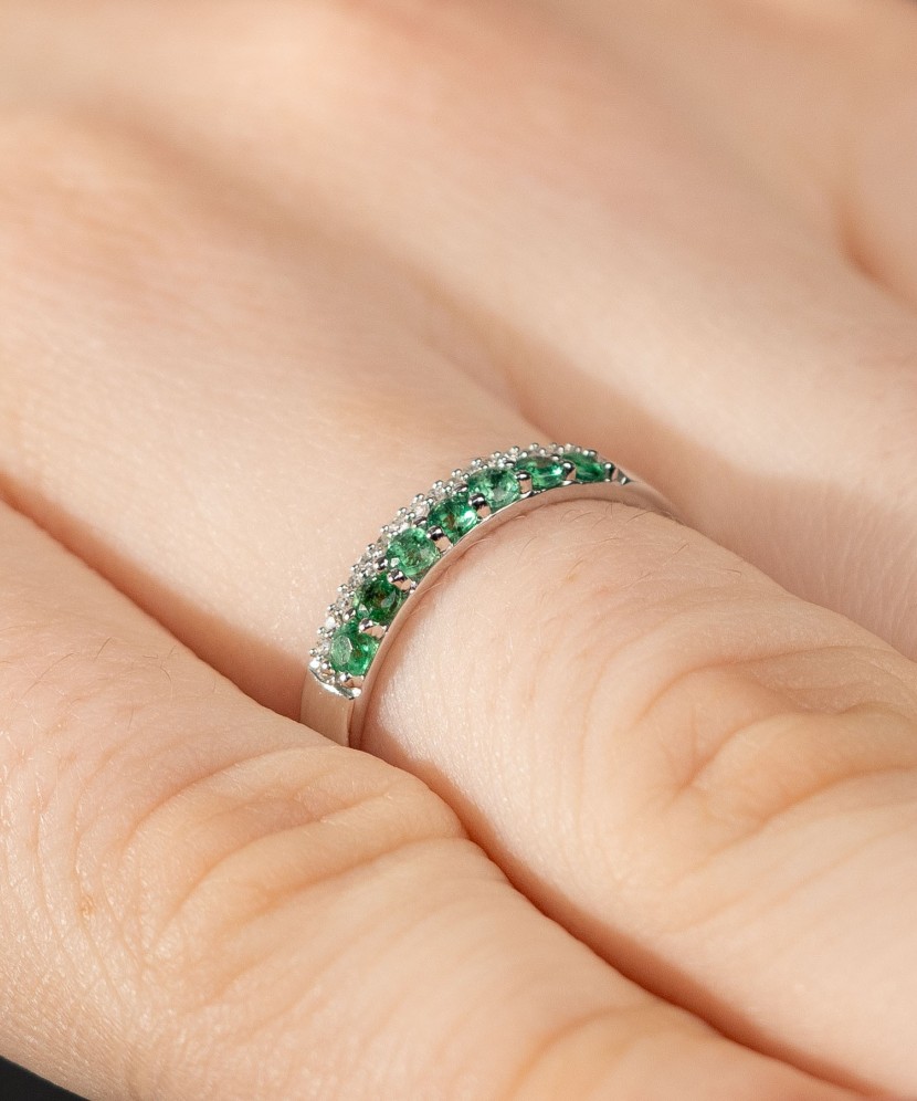 White gold ring with diamonds and emeralds