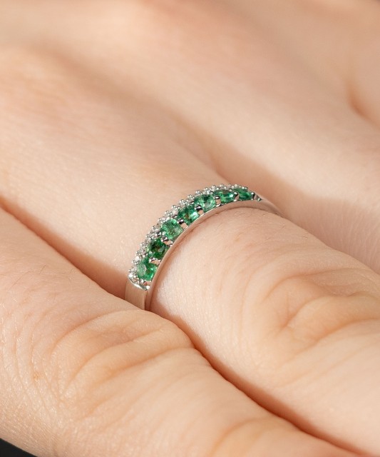 White gold ring with diamonds and emeralds