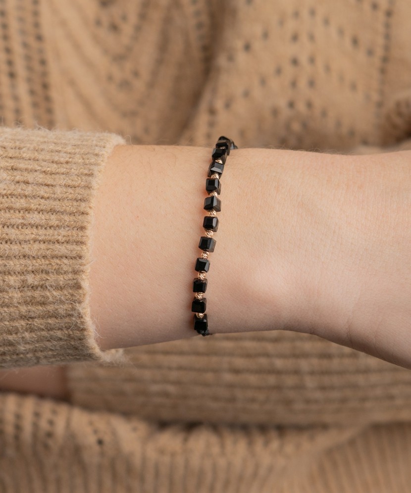 Black string bracelet with gold and onyxes