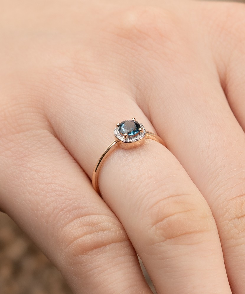 Gold ring with diamonds and London topaz