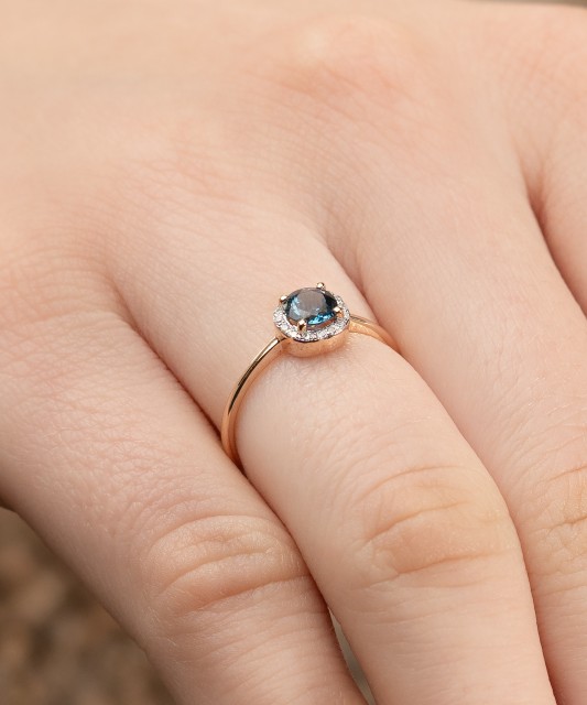 Gold ring with diamonds and London topaz