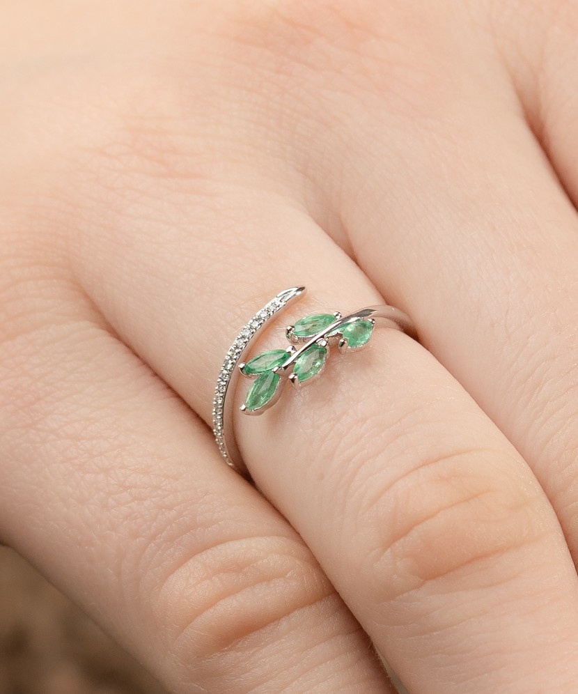 White gold ring with diamonds and emeralds