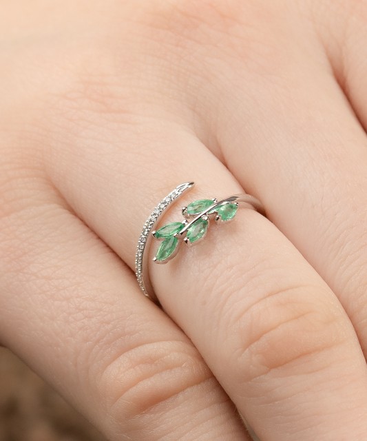 White gold ring with diamonds and emeralds