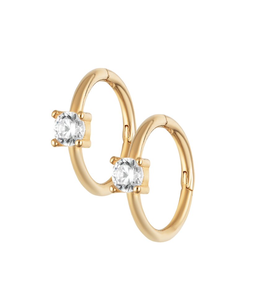 Kultaiset korvakorut zirkoneilla