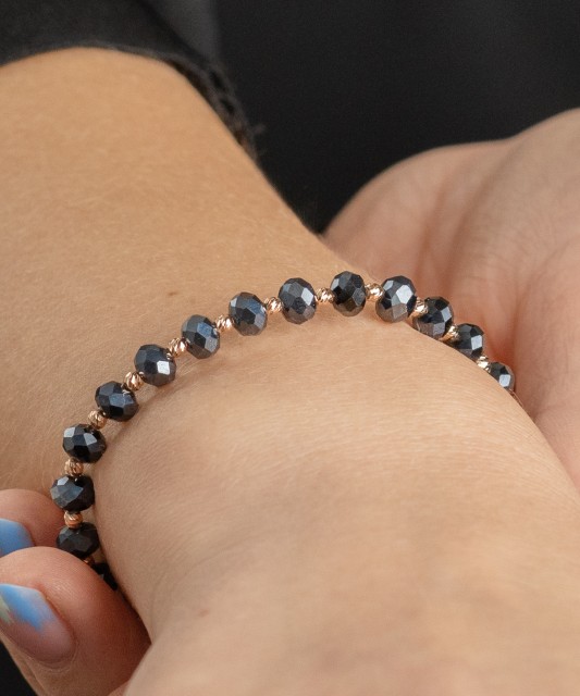 Black string bracelet with gold and onyxes