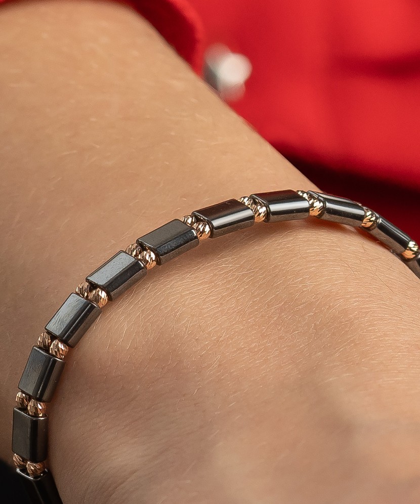 Black string bracelet with gold And Hematites