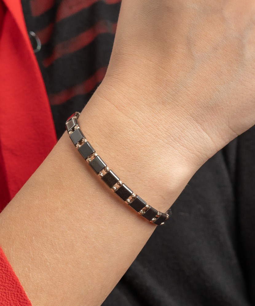 Black string bracelet with gold And Hematites