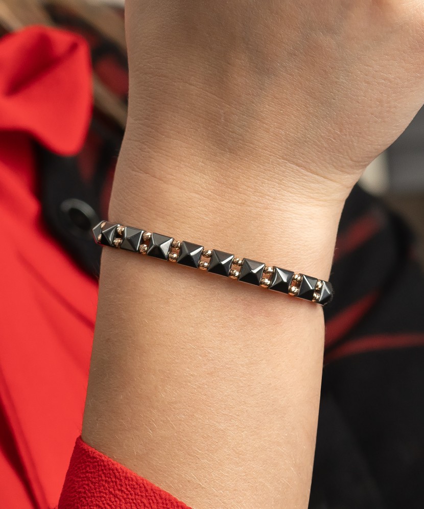 Black string bracelet with gold And Hematites