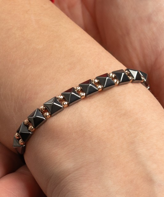 Black string bracelet with gold And Hematites