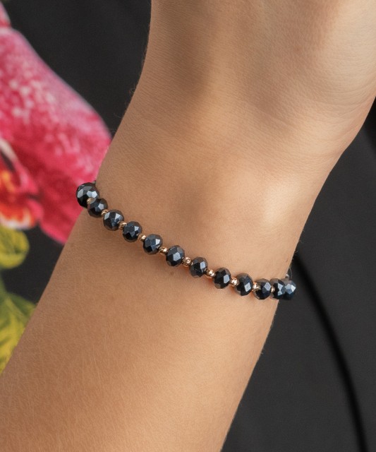 Black string bracelet with gold and onyxes