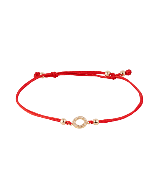 Red string bracelet with a gold pendant and zirconium